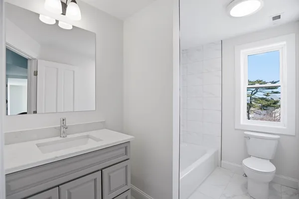 a bathroom with a bathtub and shower