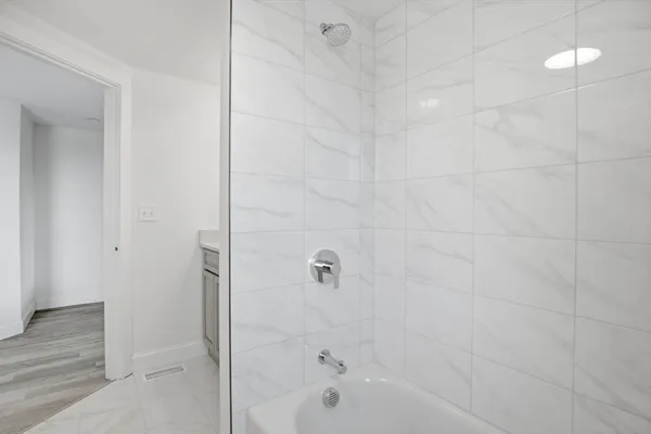 a bathroom with a sink and a window