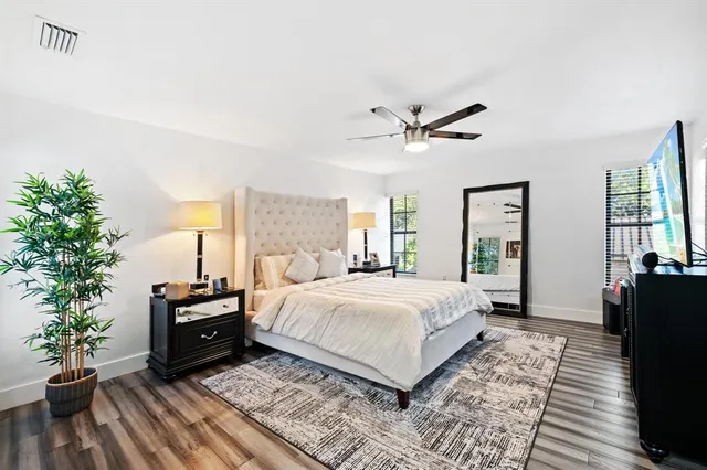 a bathroom with a double vanity sink mirror and shower