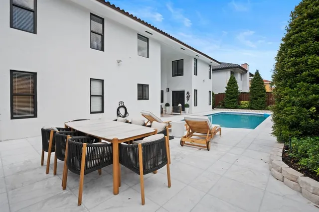 a view of a swimming pool with a patio