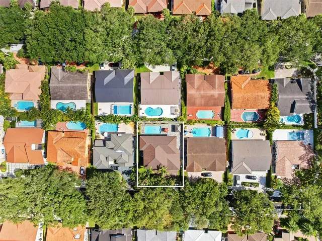 an aerial view of residential building with ocean view