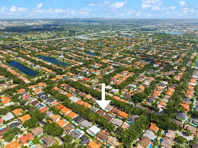 a view of a chairs and table in the patio