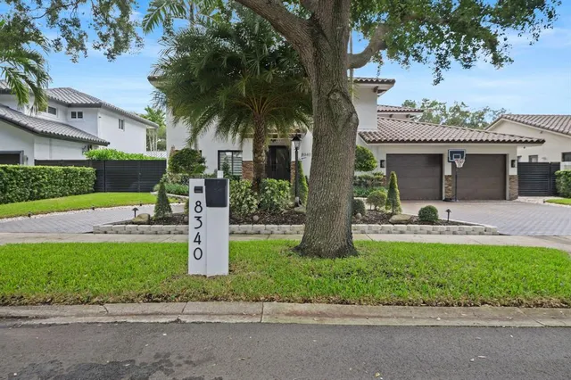 a swimming pool with outdoor seating and yard