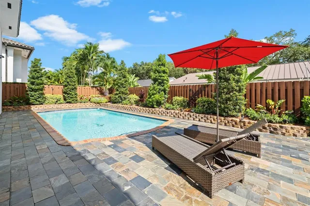 a view of a dinning table and chairs in the patio