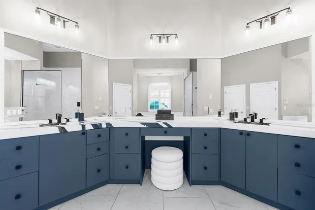 a living room with furniture a flat screen tv and a large window