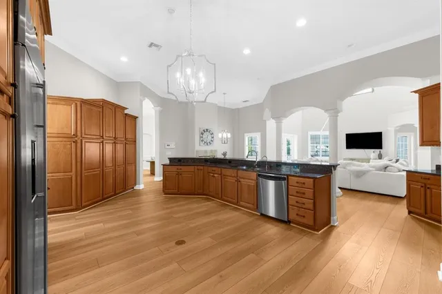 a bedroom with a bed and a table with chair