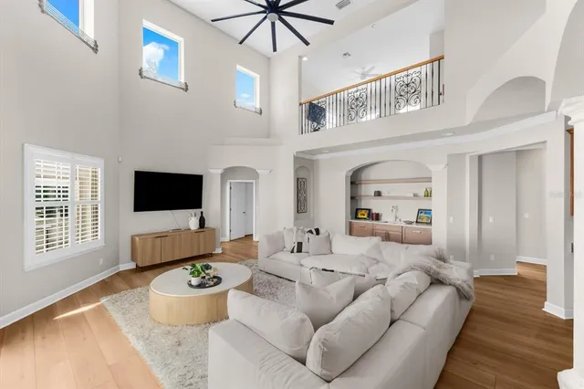 a living room with fireplace furniture and a flat screen tv