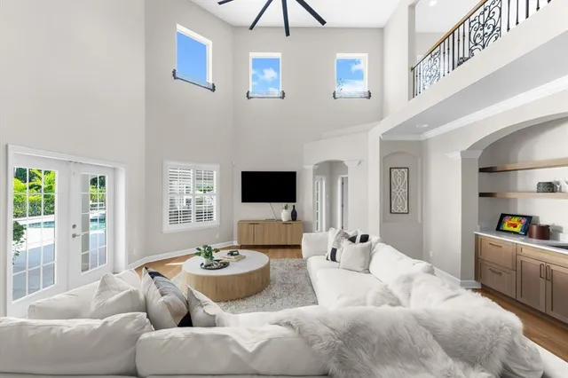 a bedroom with furniture and a flat screen tv