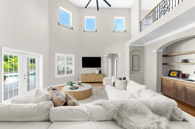 a swimming pool with outdoor seating and yard