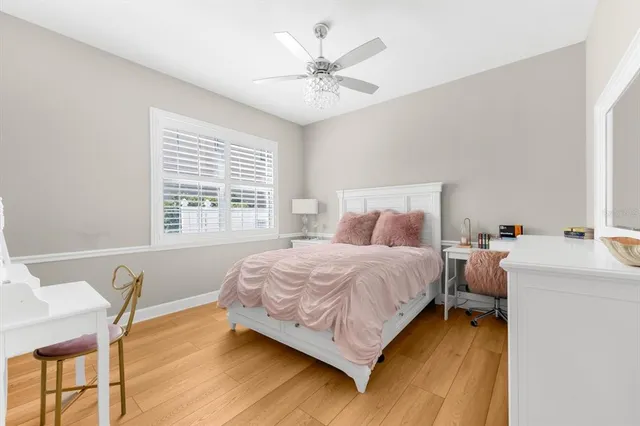 a front view of a house with swimming pool and sitting area