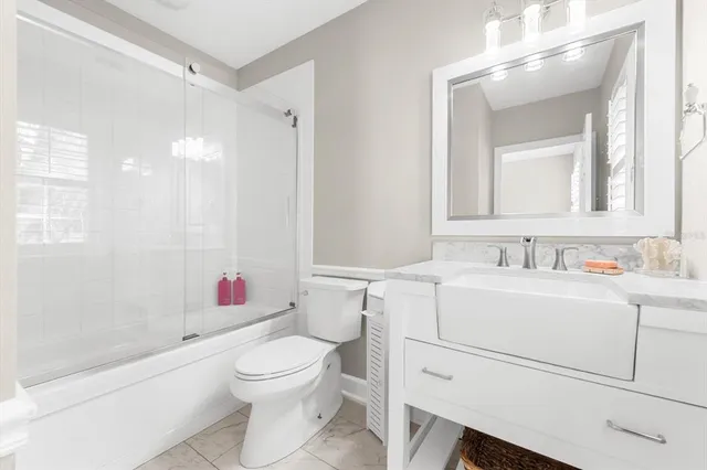 a view of a patio with a table and chairs
