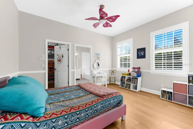 an aerial view of residential houses with outdoor space and ocean view