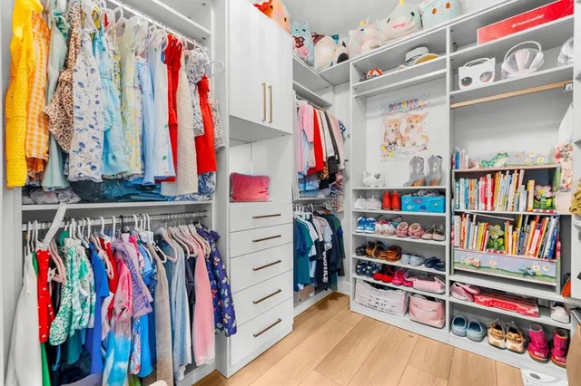 an aerial view of a swimming pool with a yard