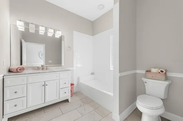 an aerial view of a house with yard swimming pool and outdoor seating