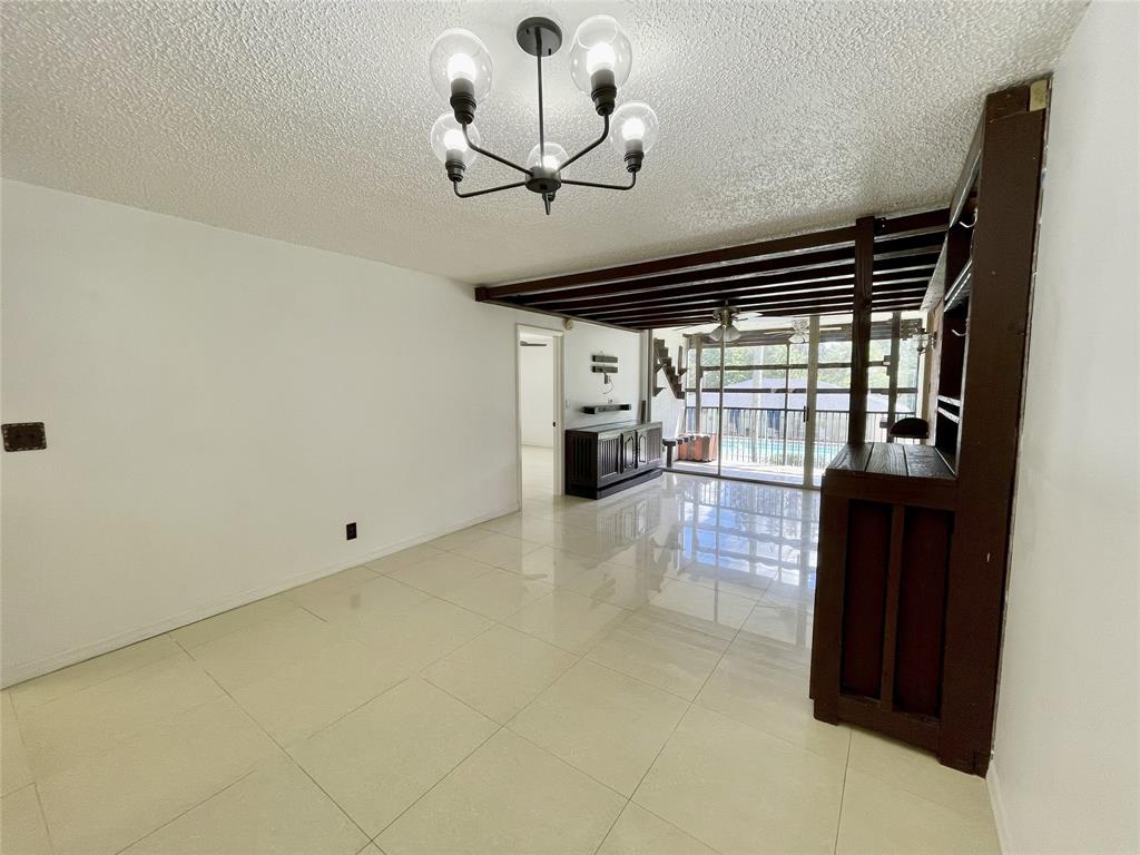 5090 Southwest 64th Avenue, Unit 204 Davie, FL 33314 - Photo 7 of 25 Built in bar is off the kitchen