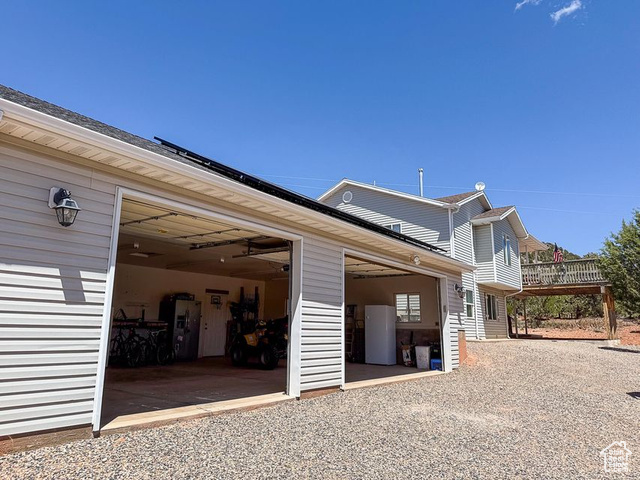 425 East Mule Deer Road Central, UT 84722 - Photo 47 of 72 View of property exterior featuring a garage and gravel driveway