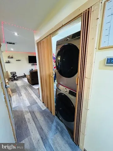 a view of a hallway with washer and dryer