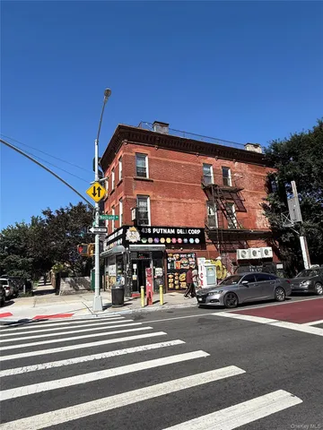a view of a food mall next to a road