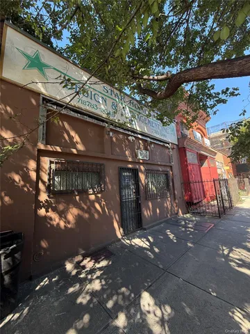 a view of a house with a tree