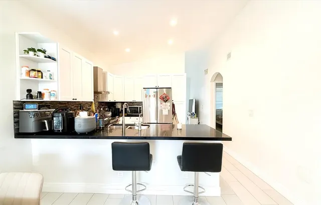 a view of living room with furniture and flat screen tv