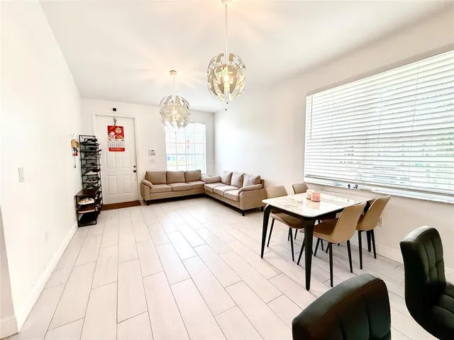 a bedroom with furniture and a chandelier