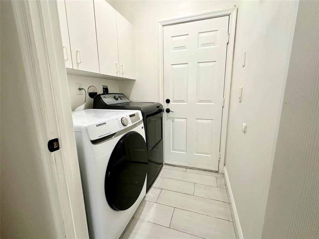 18702 Southwest 27th Street Miramar, FL 33029 - Photo 7 of 17 a utility room with dryer and washer