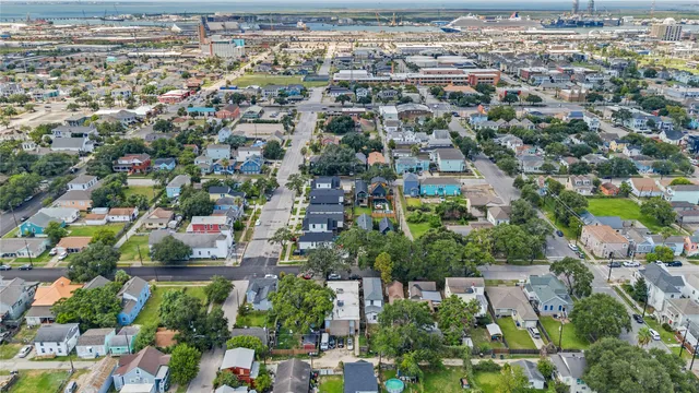 an aerial view of residential houses with outdoor space