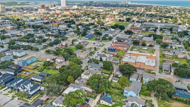 an aerial view of residential houses with outdoor space