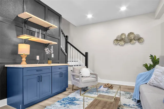 a bathroom with a sink mirror and toilet