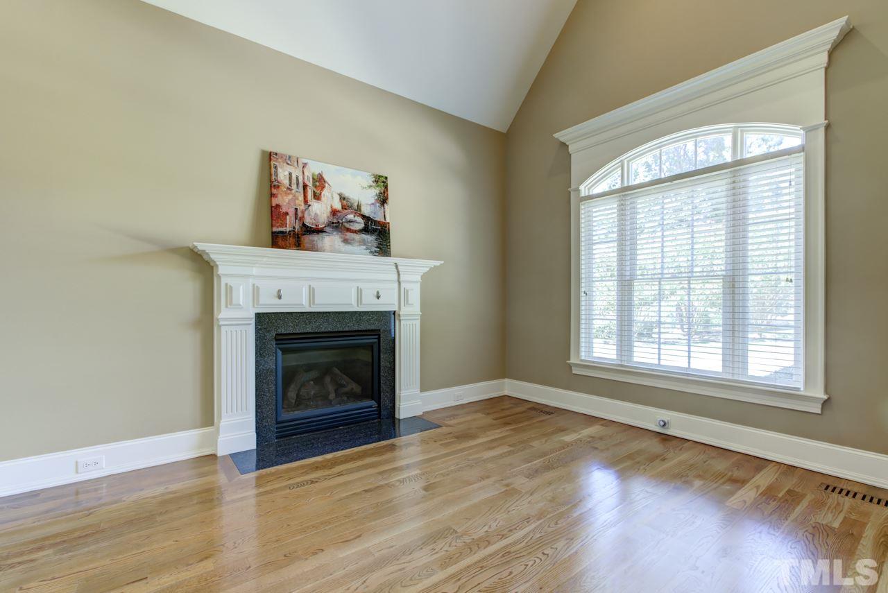1417 Wynncrest Court Raleigh, NC 27603 - Photo 3 of 25 a view of an empty room with wooden floor and a window