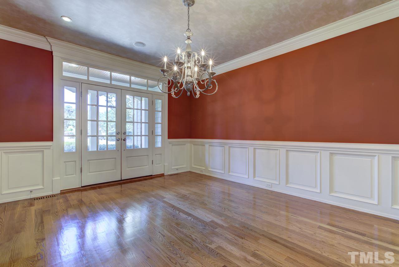 1417 Wynncrest Court Raleigh, NC 27603 - Photo 4 of 25 a view of an empty room with window and wooden floor