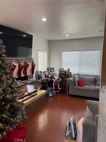 a living room with furniture gym equipment and a rug