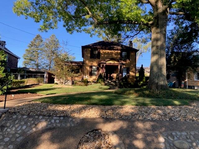 a view of a park with large trees