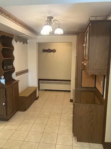 a view of a hallway with seating area