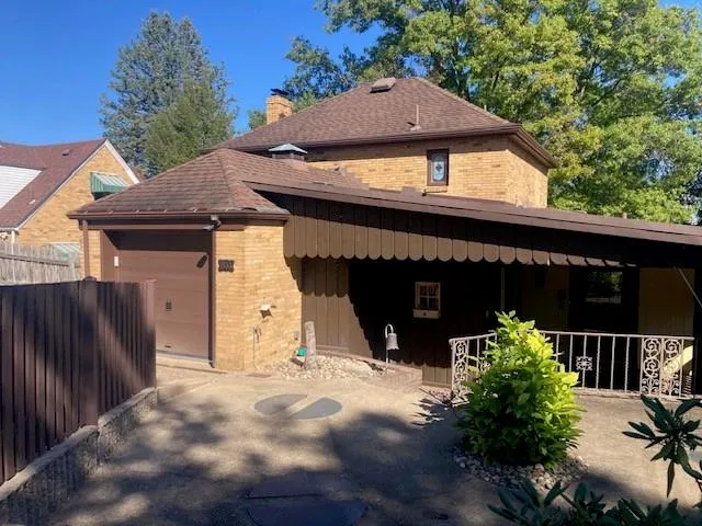 a view of a porch with a floor to ceiling window next to a yard