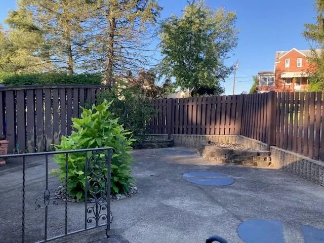 a room with a bed and a television