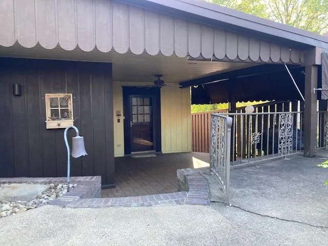 a room with wooden floor and a flat screen tv