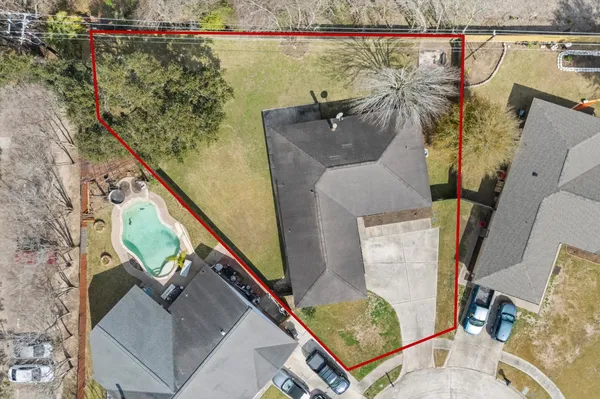 an aerial view of a house with outdoor space
