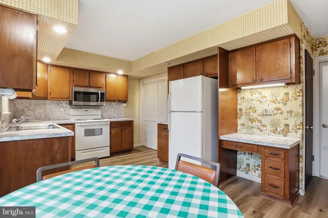 a kitchen with a refrigerator sink and microwave