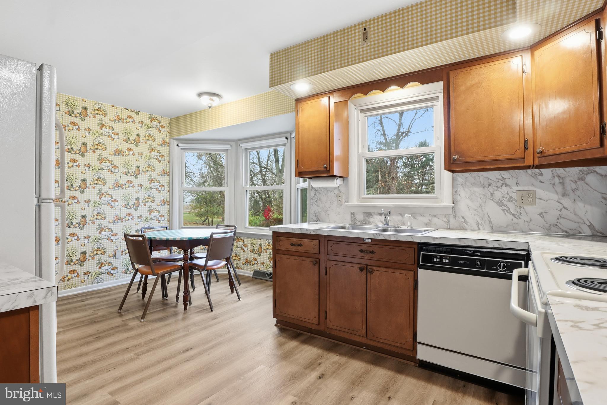 2113 Huntington Road Dover, PA 17315 - Photo 15 of 50 a kitchen with a table chairs and wooden floor