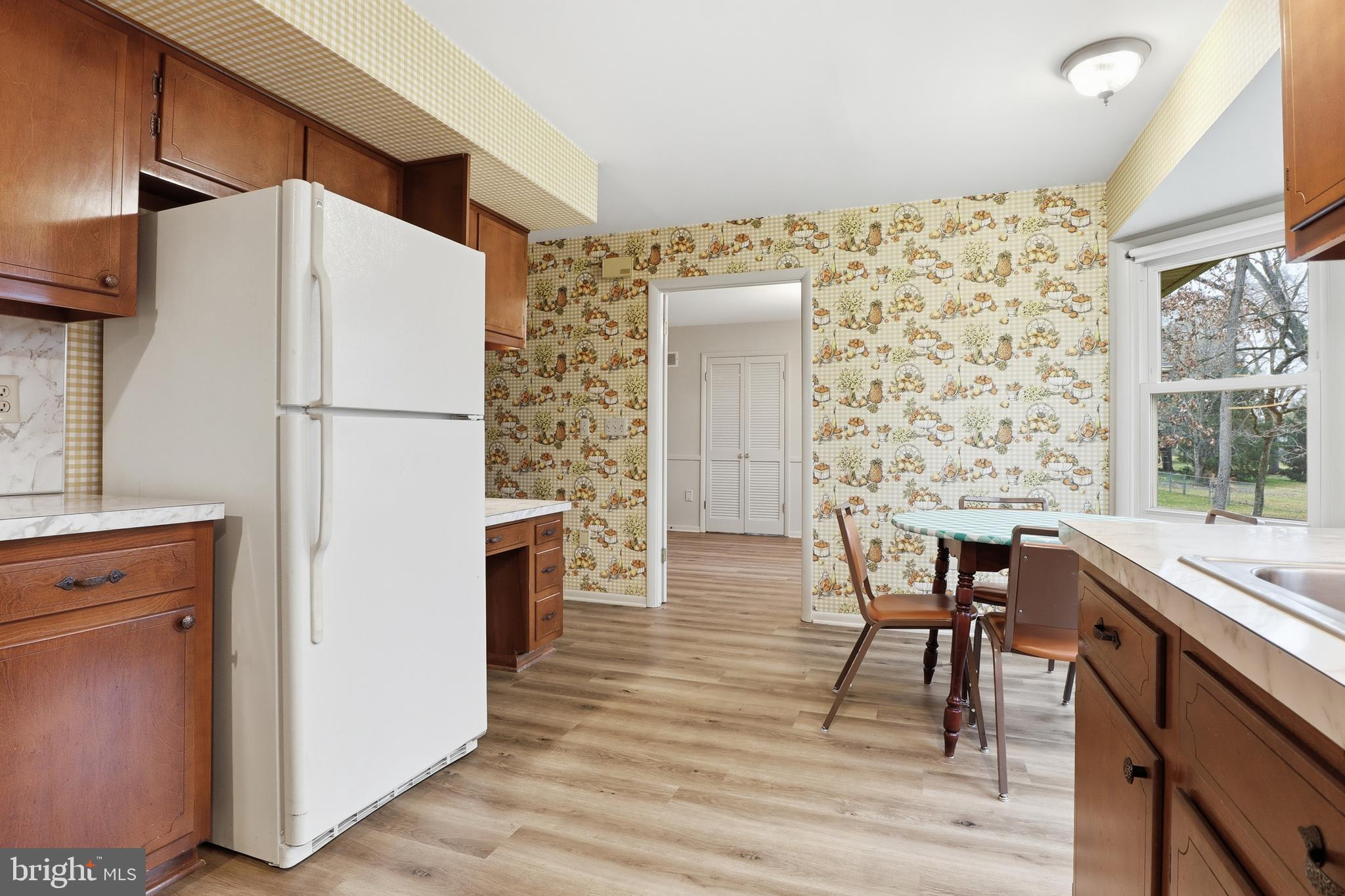 2113 Huntington Road Dover, PA 17315 - Photo 16 of 50 a kitchen with stainless steel appliances a refrigerator a table and chairs
