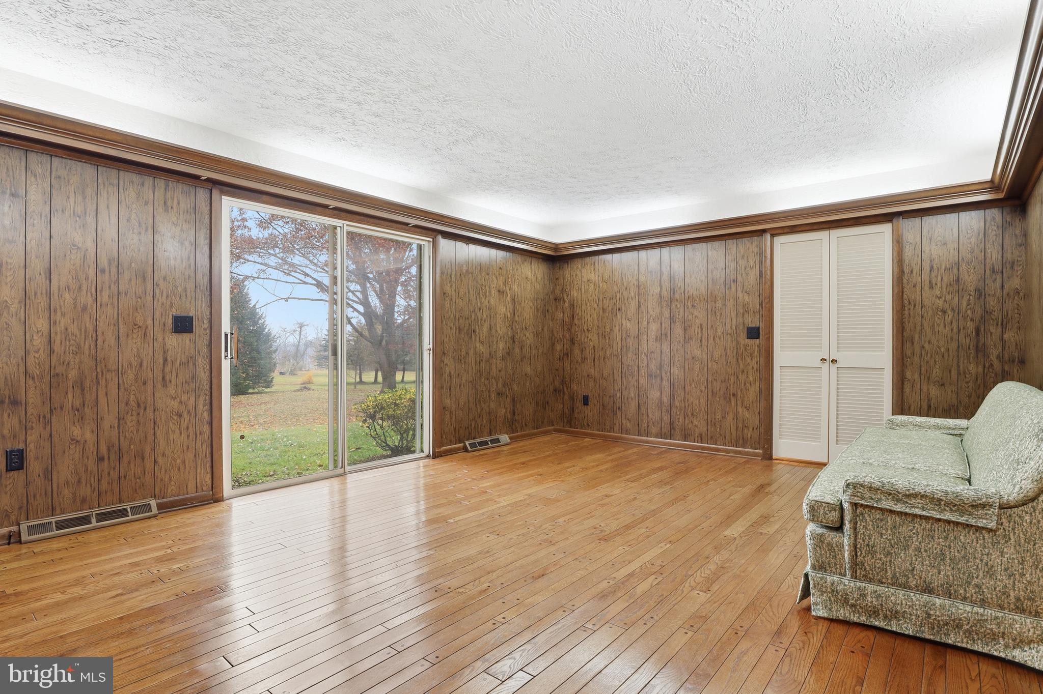 2113 Huntington Road Dover, PA 17315 - Photo 19 of 50 a view of an empty room with wooden floor and a window