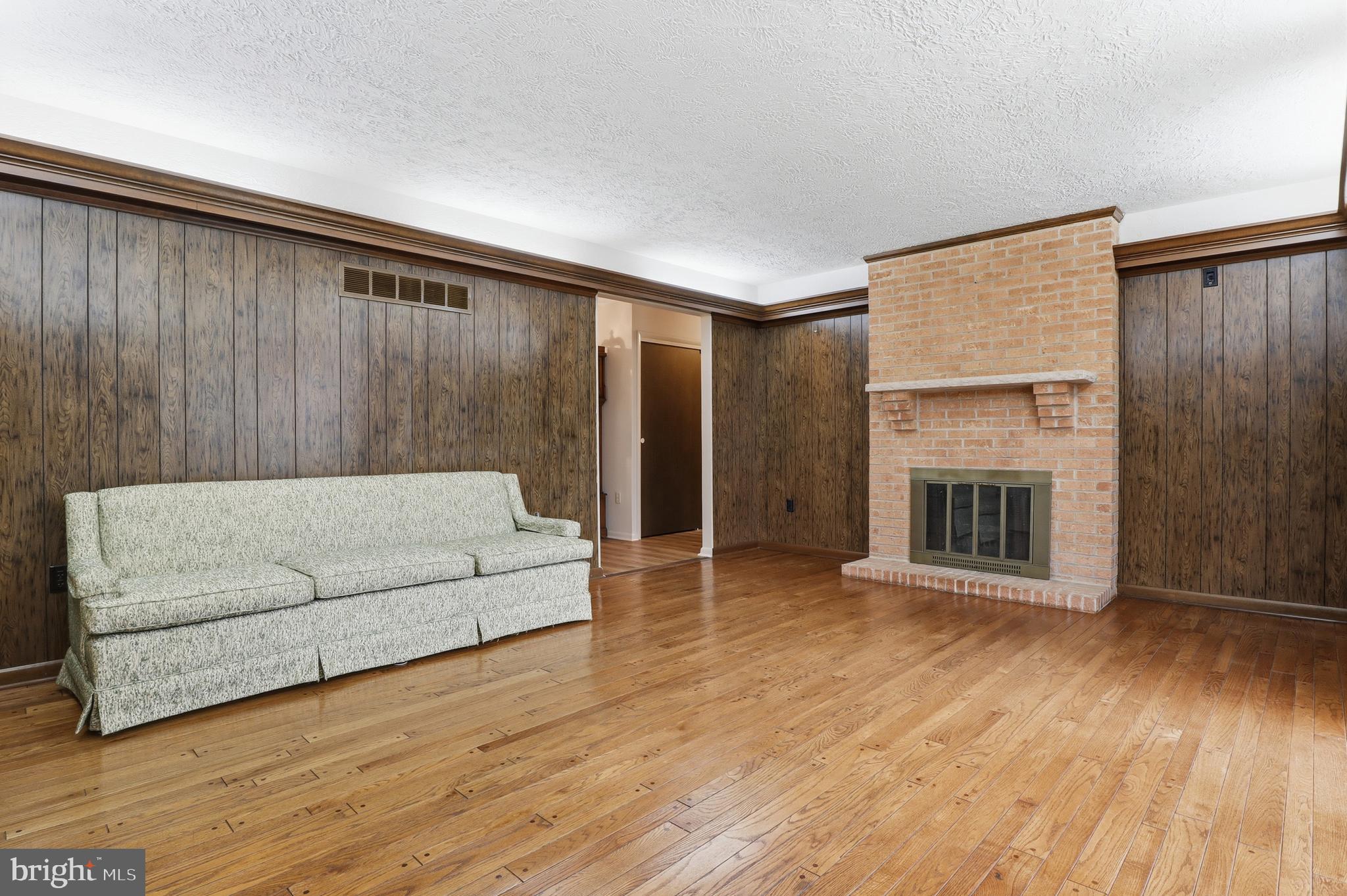2113 Huntington Road Dover, PA 17315 - Photo 20 of 50 a living room with furniture and a fireplace