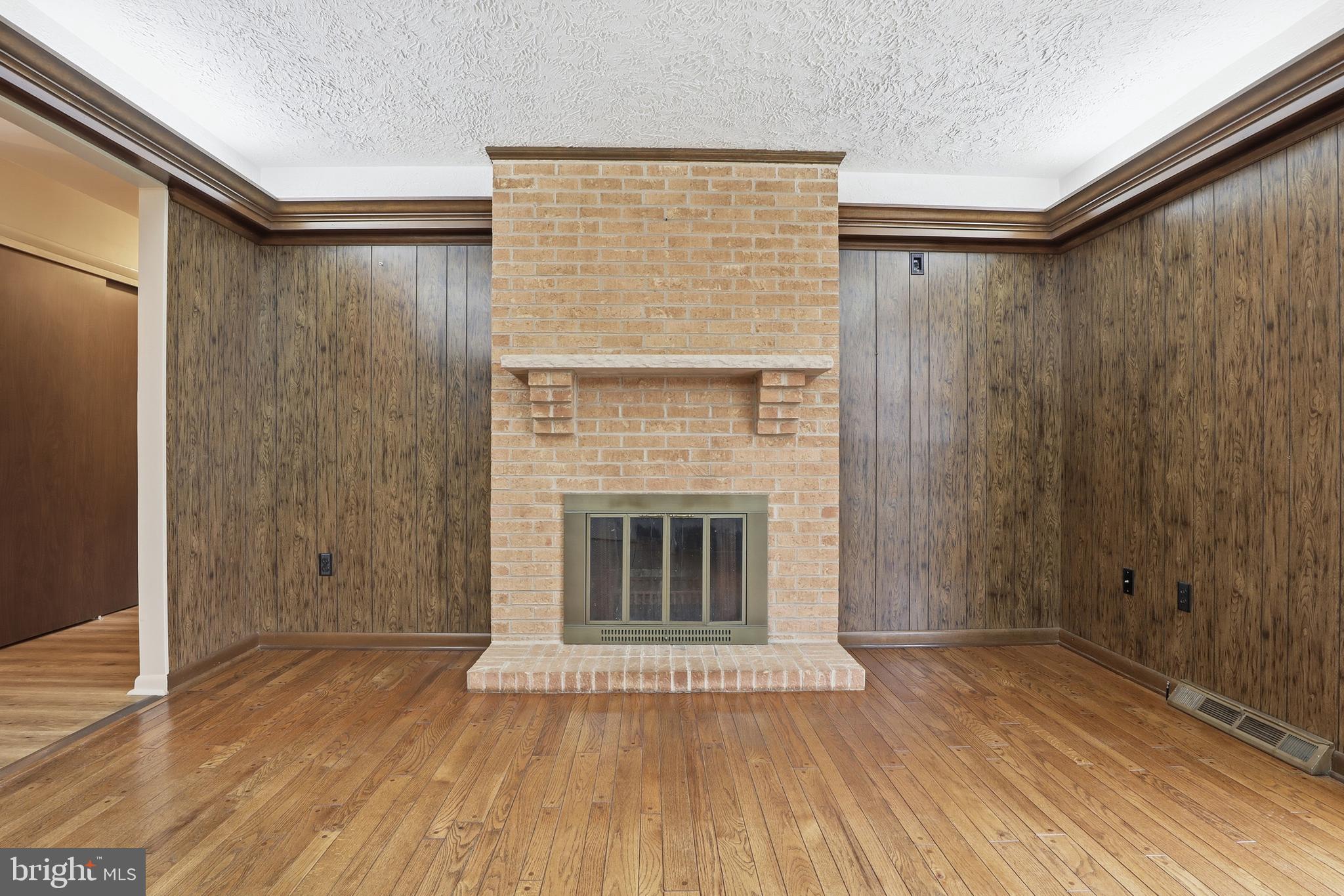 2113 Huntington Road Dover, PA 17315 - Photo 21 of 50 a view of empty room with wooden floor and fireplace