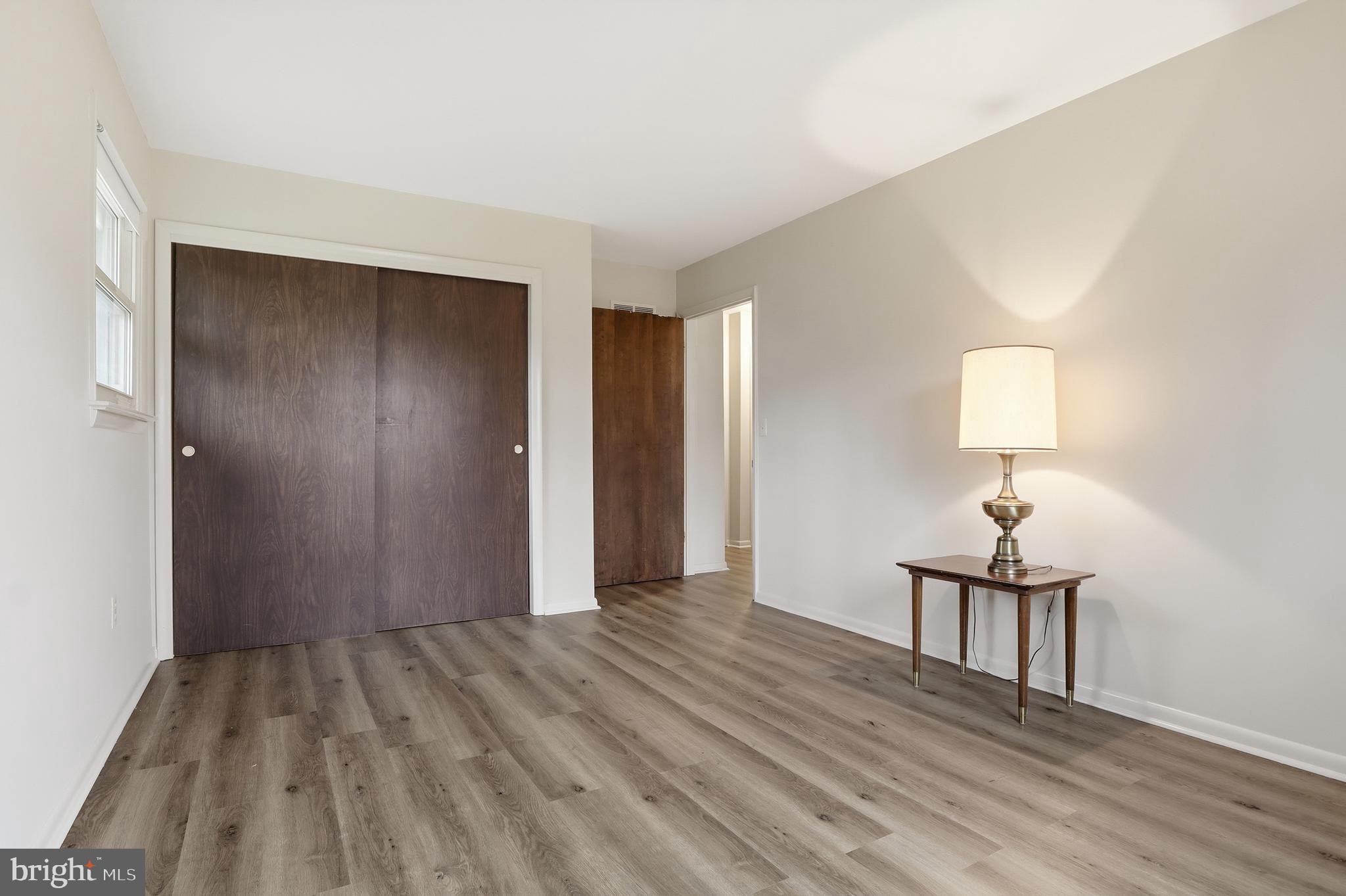 2113 Huntington Road Dover, PA 17315 - Photo 24 of 50 a view of a room with wooden floor and lamp