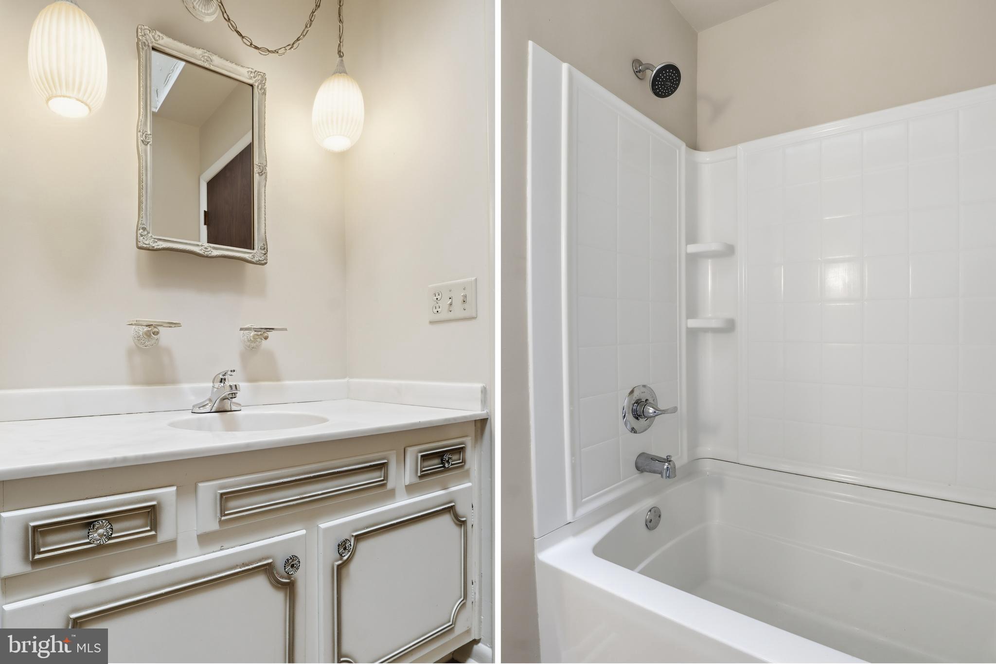 2113 Huntington Road Dover, PA 17315 - Photo 26 of 50 a bathroom with a sink a vanity a mirror and a bathtub