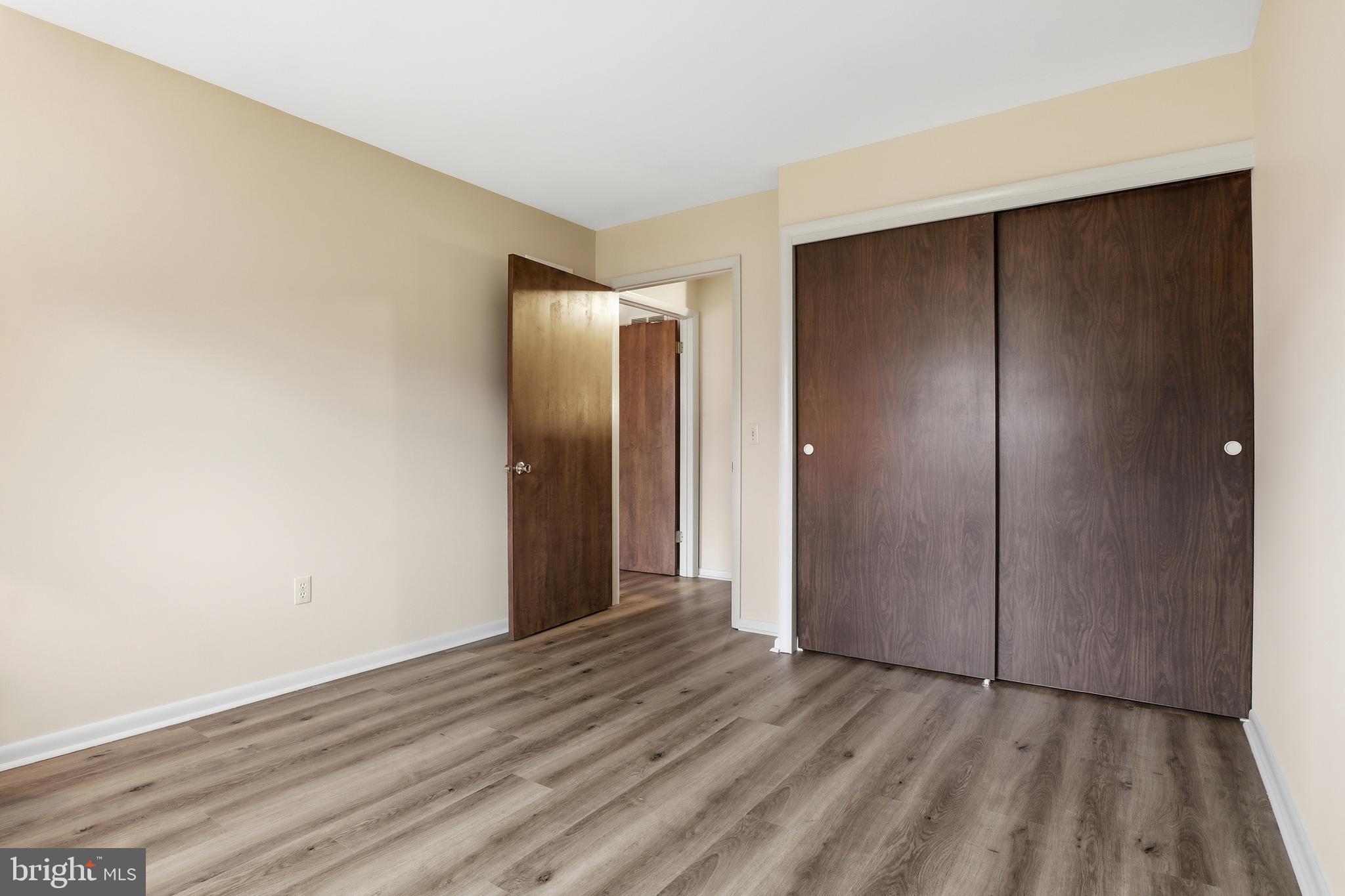 2113 Huntington Road Dover, PA 17315 - Photo 28 of 50 a view of an empty room with wooden floor and closet