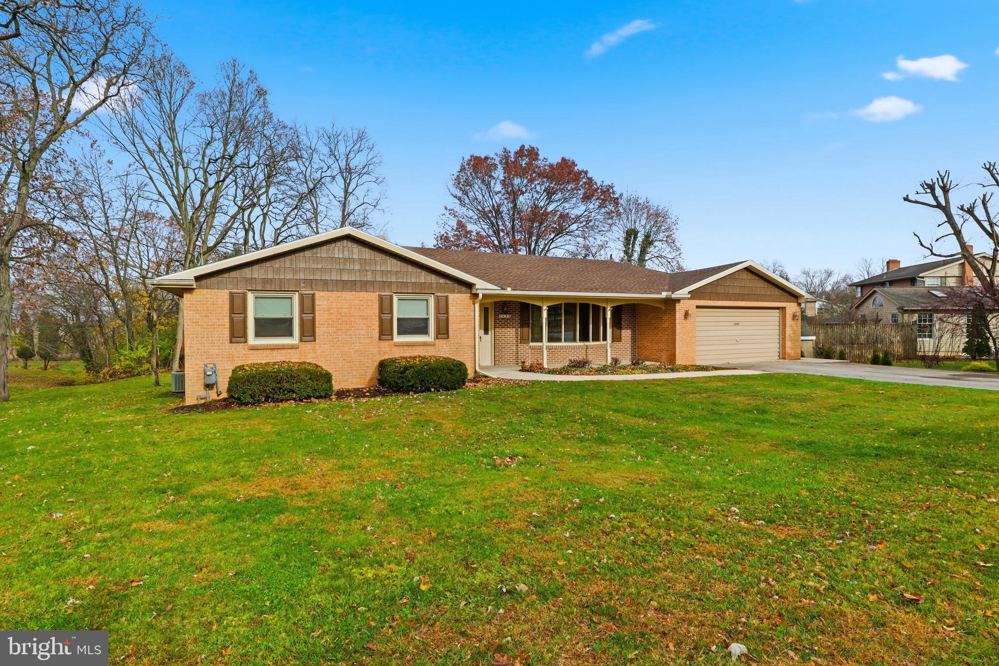 2113 Huntington Road Dover, PA 17315 - Photo 4 of 50 a front view of a house with a garden