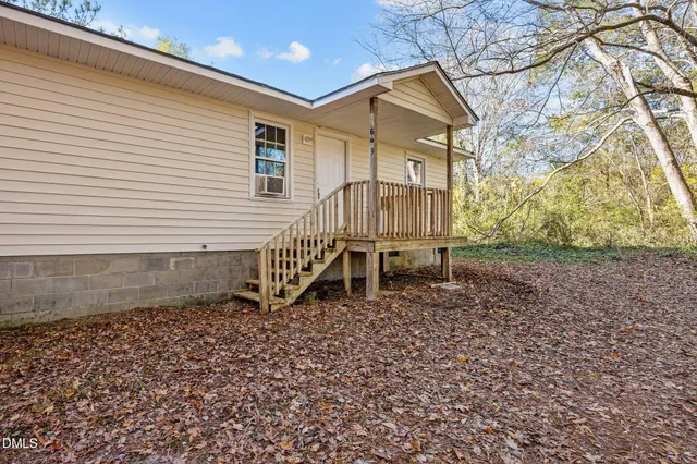 a view of a balcony with wooden floor