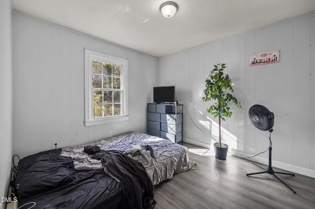 a view of walk in closet with wooden floor